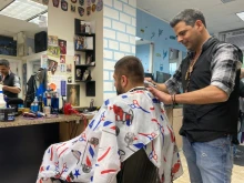 Elias Elsayah at Chris and Sam's Barber Shop in Norwood, Massachusetts
